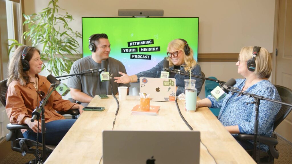 People sitting at a table recording a podcast episode of Rethinking Youth Ministry. This is the header image for the blog, 5 Practical Ways to Care for Your Soul in Ministry.